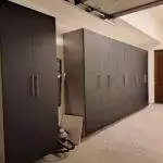 a room with black cabinets and a vacuum