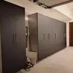 a room with black cabinets and a vacuum