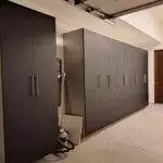 a room with black cabinets and a vacuum